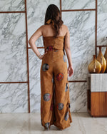 Load image into Gallery viewer, MUSTARD PRINTED HALTER NECK FLARED JUMPSUIT
