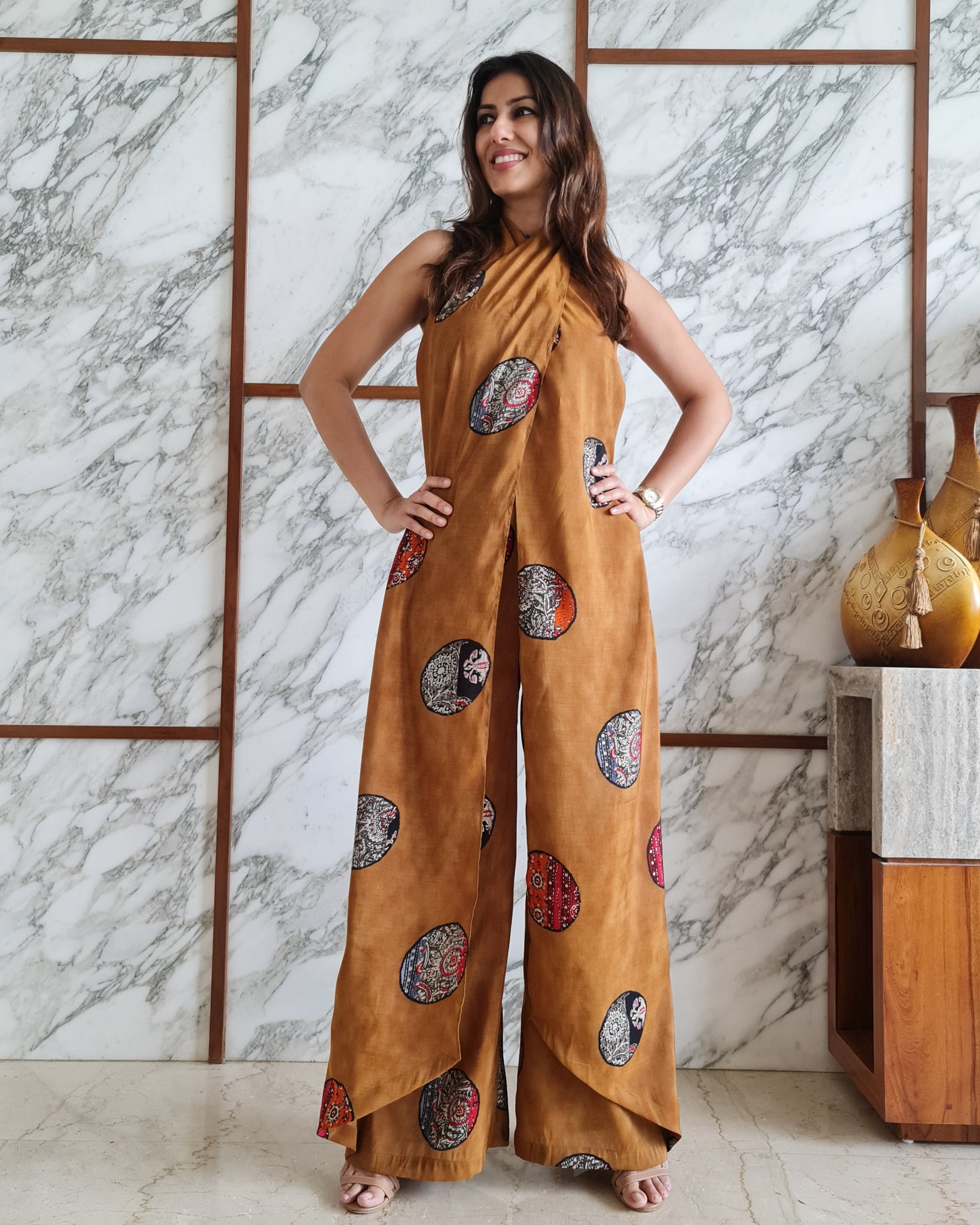 MUSTARD PRINTED HALTER NECK FLARED JUMPSUIT
