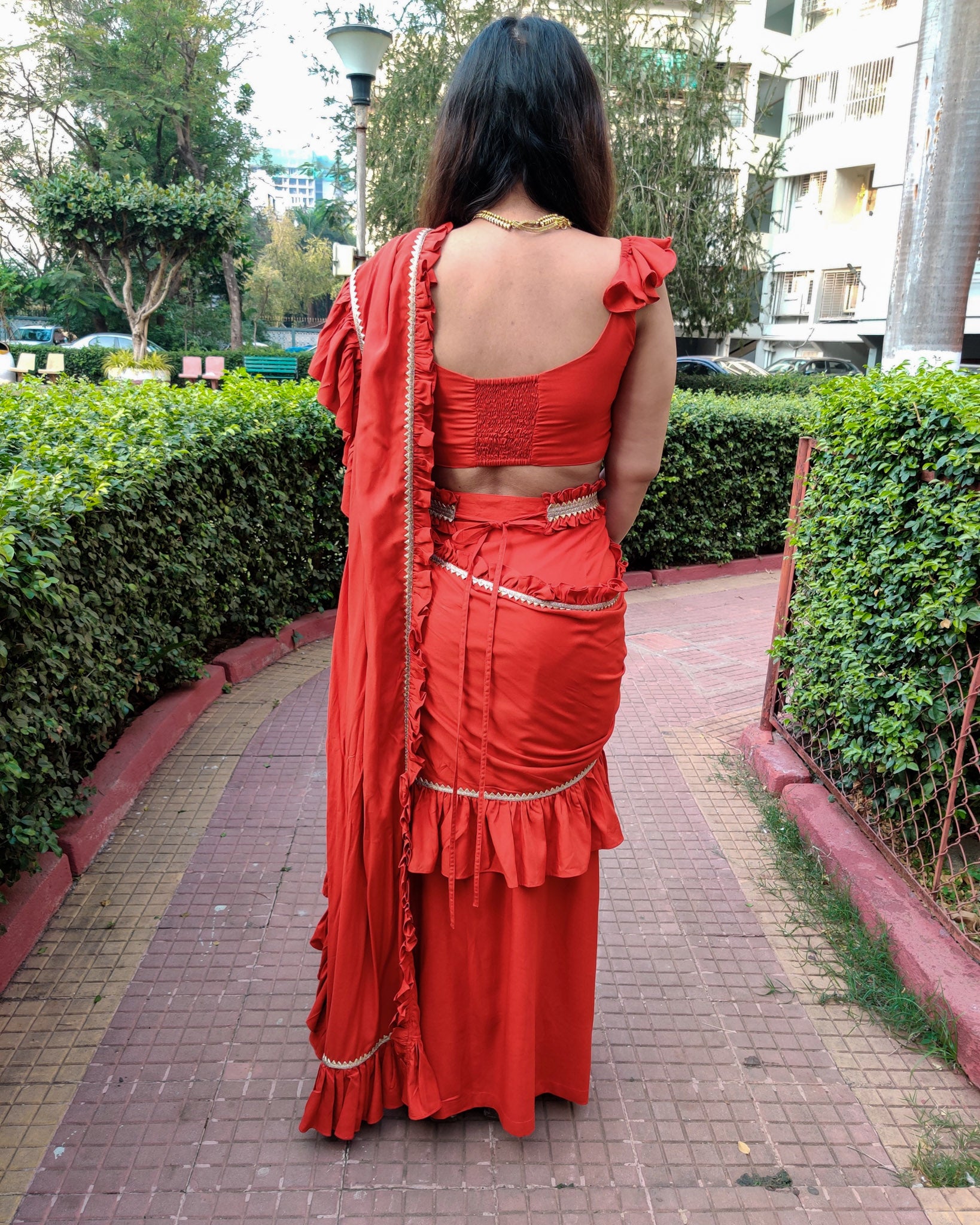 RED RUFFLE SKIRT SAREE WITH FRILLED BLOUSE